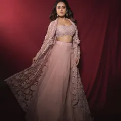A full-length view of this dreamy pastel pink lehenga with a detailed lace jacket I styled for Nushrratt Bharuccha. This is an ideal choice for a bridesmaid or a sangeet.