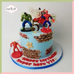 This superhero cake brings together the mightiest heroes for an epic 5th birthday. The design features a cool exposed brick effect and action figures of Hulk, Spider-Man, and Iron Man, ready to celebrate.