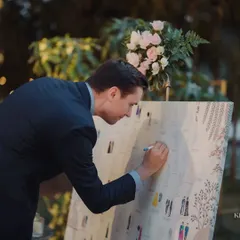 An interactive and personal touch. Guests had fun finding their illustrated selves on this custom guest board and coloring in their outfits, creating a collaborative and colorful memento of the day.