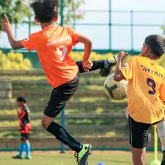 A moment of pure athletic skill as a player connects with the ball mid-air. My league is filled with these displays of talent and determination from young football players.