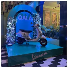 Here is another view of the main stage for the custom painted Vespa. The elevated platform, branded base, and professional lighting ensure the product is visible and looks spectacular from every angle.