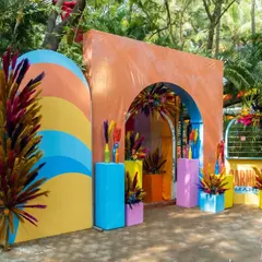 The entrance to our 'Carnival Mania' event, designed with bold, colorful arches and vibrant floral arrangements to set a fun and festive tone.
