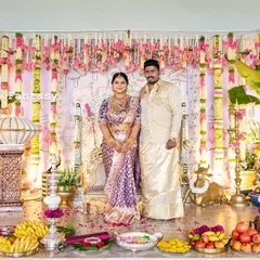 The happy couple at their son's naming ceremony, standing before the elaborate stage I designed. My goal is always to create a backdrop that not only looks beautiful in photos but also feels special for the family celebrating.