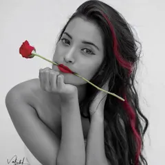 A close-up version of my selective color series. This black and white portrait with pops of red draws all the attention to the model's face, creating a striking and intimate artistic shot.