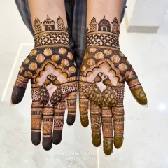 Another view of the traditional peacock and palace mehendi, showing the fresh henna application. The details are sharp and clear, promising a beautiful stain.