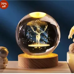 This crystal ball lamp with a glowing deer and stars inside adds a touch of magic to any space. It's an elegant and unique decorative item.