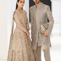 For this couple, we chose a sophisticated champagne and beige palette. I crafted a heavily embroidered lehenga for her and a matching sherwani for him, ensuring every detail was in sync for a regal and cohesive look.