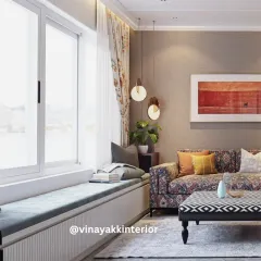We love creating cozy nooks for relaxation. This window seat with built-in storage is the perfect spot to read a book, enjoying the natural light that fills the room through sheer curtains.