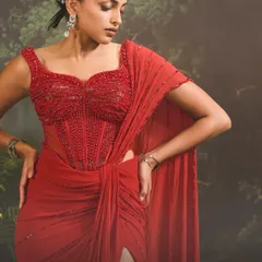A closer look at the Stardust Saree Set, where I've focused on the intricate beadwork of the corset blouse. This piece redefines traditional wear, offering a structured, glamorous silhouette with a thigh-high slit for a contemporary edge.