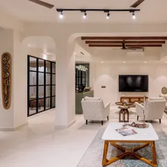 A wide view of the open-plan living and lounge area in 'Project Lily', showing the seamless flow between different zones, unified by an earthy color palette and modern furniture.
