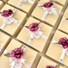 For a corporate Diwali order with BDI Plus, we designed these sophisticated gift boxes. Each one was finished with a custom-branded ribbon and a floral accent, creating a warm and festive gift for their team members.