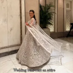 My gorgeous client dazzling in a heavy silver lehenga. She looks like a dream, twirling and shining at her event. This is the magic of renting luxury!