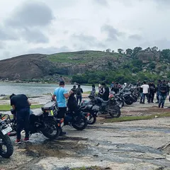 Our riders and their bikes parked by the serene Mydala Kare Lake during a breakfast ride. These rides are as much about the destination and the conversations as they are about the journey.