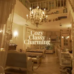 Cozy, classy, and charming. This wide view showcases the different seating arrangements and the airy, open feel of the bistro, all under the soft light of our beautiful chandeliers.