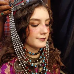 Final touches on a traditional, rustic-themed look. I created a flushed, sun-kissed effect on the cheeks and nose, adding freckles to complete the character makeup.