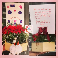 A beautiful wedding hamper to congratulate a newly married couple. It includes a floral arrangement in a wooden box, a miniature doll, and a handwritten card with best wishes.
