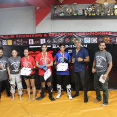 Our team of coaches and victorious female fighters at the Open Club Kickboxing & Grappling Championship. Their medals are a direct result of their dedication and rigorous training.