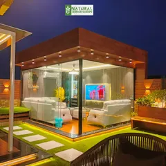 Our all-weather glass house, designed as a seamless extension of the home. This fully enclosed, air-conditioned space allows for year-round enjoyment of the terrace, featuring modern interiors and floor-to-ceiling glass for unobstructed views.