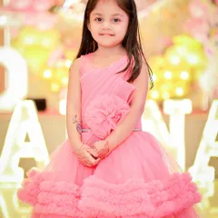 A closer portrait shot, focusing on her happy expression and the details of her tiara. Sharp, clear portraits are a must-have at any birthday party.