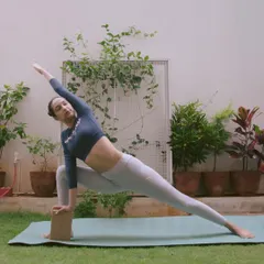 Using props isn't a shortcut, it's a smart way to practice. Here, I'm using a yoga block in Parsvakonasana (Extended Side Angle Pose) to ensure proper alignment and a deeper, safer stretch. In my one-on-one sessions, we use props to make poses work for your body.