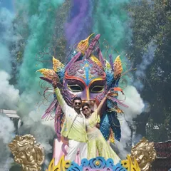 Your pre-wedding carnival should be an explosion of fun and personality. I create larger-than-life themed entries, like this massive carnival mask float, complete with color smoke and performers to kickstart the celebration with a bang.