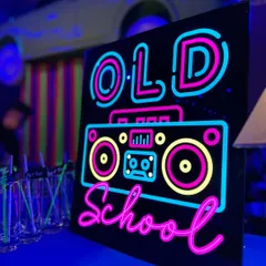 A custom "Old School" neon sign featuring a boombox design. These signs are a core part of our neon themes, adding a personalized and vibrant touch to the bar area.