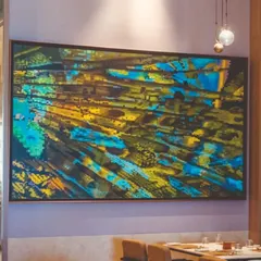 This paradoxically invigorating abstract piece adds a dynamic burst of color and energy to a dining space at the JW Marriott Bengaluru.