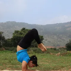 Fitness is not about being lean; it's about how your body functions. Here I am in a scorpion pose variation, demonstrating the strength and mobility that comes from a consistent practice, regardless of body type.