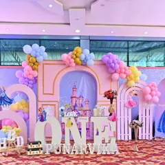 A fairytale first birthday fit for a little princess. We built a complete castle scene with multiple backdrops, character cutouts, and dreamy pastel balloon arches to bring this magical Disney theme to life for Punarvika.