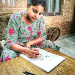 I am an artist, and this is my identity. This is a photo of me completely absorbed in my work, sketching with pencil and bringing an idea to life on paper.