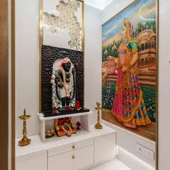The other side of the mandir features another beautiful painting of Radha ji, creating a symmetrical and harmonious design. The space is illuminated with soft, warm light to create a serene atmosphere.