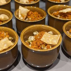 For catering events, I often serve tasting portions of my classic dishes, like this Kanji Payar. These small bowls allow guests to sample a variety of flavors without getting too full, making for a great start to a multi-course meal.