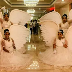 Our angel wing performers posing for a photo at the Radisson Blu. This themed welcome is one of our most requested services for adding a touch of elegance and fantasy to corporate events and weddings.