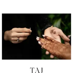 A moment of anticipation just before the ring is placed on her finger. This shot captures the intimacy and significance of the engagement ritual.