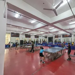 A view of our tournament hall in full swing. I ensure a professional setup with multiple STAG tables, proper flooring, and excellent lighting, creating the perfect arena for serious competition.