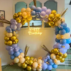 A stylish and modern balloon ring backdrop using a pastel palette of purple, blue, and yellow, accented with chrome gold balloons. This versatile design is perfect for birthdays, baby showers, or any chic celebration.