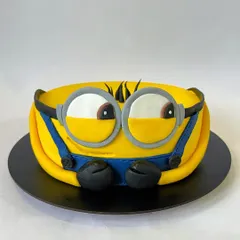 You are one in a minion! This playful Minion cake is carved to shape and covered in fondant to capture the character's iconic look. It's a fun design that's sure to make everyone smile.