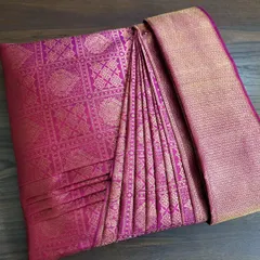 This rich magenta silk saree, prepped for a Sri Lankan bride, shows the final box-folded presentation. It’s a beautiful and practical way to handle precious sarees.