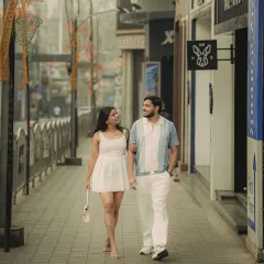 A candid shot of the couple strolling down a stylish, cobblestone-like street in Bangalore. This image captures the feeling of simply enjoying a day out in the city together.