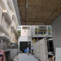 This image captures the project during the construction phase, with scaffolding in place. We oversee every stage to ensure the structural and architectural integrity of our design is realized.