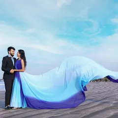 Steal colors from the sky with this blue wave pre-wedding gown. The ombre effect and the extra-long tail create a stunning visual against a beach backdrop, making your photos look like a painting.