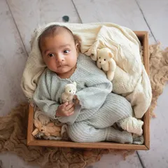 An individual portrait of the baby boy from the twin set, looking curious and wide-eyed. I always make sure to get solo shots of each twin.