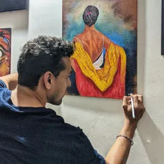 Adding the final touches to a canvas painting. This moment is about refining the details that bring the entire artwork together. It’s a satisfying part of the process that we work towards in my classes.