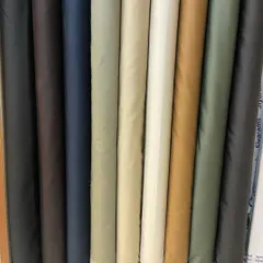 My collection of solid-colored fabrics in 100% silk cotton, available in a range of classic and contemporary shades for your custom suit or formal trousers.