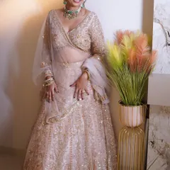 A full-length view of this bride's stunning pastel lehenga. My makeup and styling are designed to celebrate her natural beauty and create an unforgettable glow.