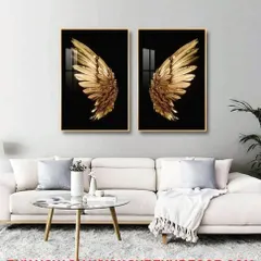 This dramatic two piece crystal painting set displays a pair of golden angel wings against a stark black background. It is a bold and aspirational art piece, perfect for a modern living space.