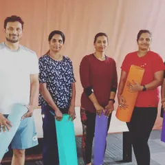 Our members ready for a yoga session, mats in hand. We welcome everyone, from complete beginners to those looking to deepen their practice, into our yoga community.