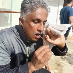 A student practices Sutra Neti, using a thread to cleanse the nasal passages. This is an advanced kriya that we teach with careful, step-by-step guidance.