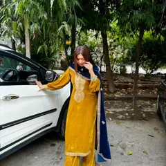 A full look at this beautiful winter velvet suit. The deep blue velvet dupatta provides a stunning contrast, making it a standout piece for any winter occasion.