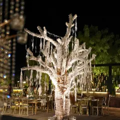 A closer look at the magnificent crystal tree centerpiece. This custom-built installation, draped in thousands of crystals and surrounded by candles, was the focal point of our Gatsby-themed Sangeet decor.